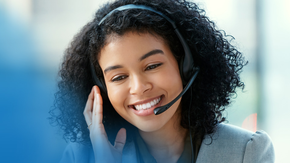 A ConServe customer care specialist communicating with a client on a headset phone